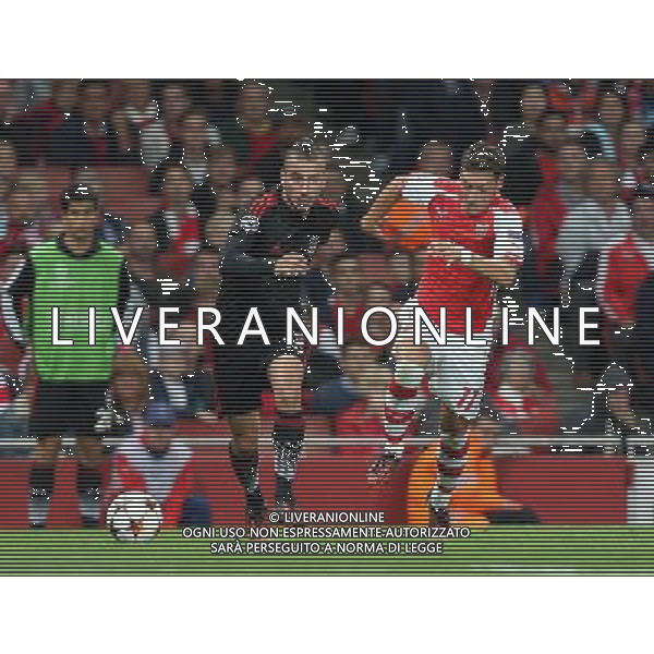 Oguzhan Ozyakup of Besiktas holds of Arsenal\'s Mesut Ozil Photo by Kieran Galvin/CameraSport Football - UEFA Champions League Qualifying Play-Offs Round Second Leg - Arsenal v Besiktas - Wednesday 27th August 2014 - Emirates Stadium - London © CameraSport - 43 Linden Ave. Countesthorpe. Leicester. England. LE8 5PG - Tel: +44 (0) 116 277 4147 - admin@camerasport.com - www.camerasport.com /Agenzia Aldo Liverani sas - ITALY ONLY - EDITORIAL USE ONLY