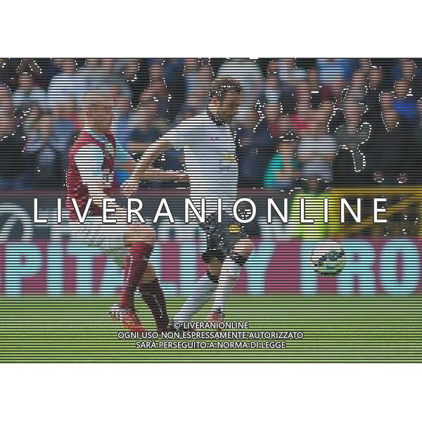 Manchester United\'s Juan Mata shields the ball from Burnley\'s David Jones Photographer Chris Vaughan/CameraSport Football - Barclays Premiership - Burnley v Manchester United - Saturday 30th August 2014 - Turf Moor - Burnley © CameraSport - 43 Linden Ave. Countesthorpe. Leicester. England. LE8 5PG - Tel: +44 (0) 116 277 4147 - admin@camerasport.com - www.camerasport.com /Agenzia Aldo Liverani sas - ITALY ONLY - EDITORIAL USE ONLY