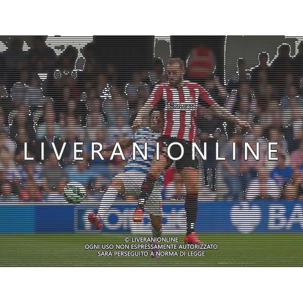 Sunderland\'s Steven Fletcher is tackled by Queens Park Rangers\' Mauricio Isla Photographer Ashley Western/CameraSport Football - Barclays Premiership - Queens Park Rangers v Sunderland - Saturday 30th August 2014 - Loftus Road - London © CameraSport - 43 Linden Ave. Countesthorpe. Leicester. England. LE8 5PG - Tel: +44 (0) 116 277 4147 - admin@camerasport.com - www.camerasport.com ag aldo liverani sas only italy