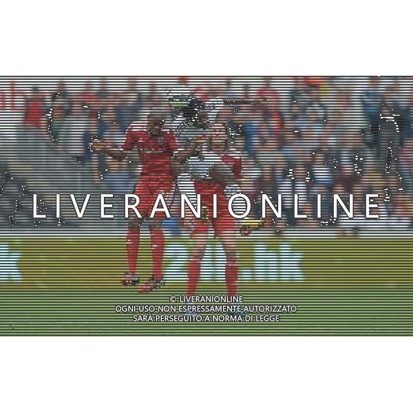 Swansea City\'s Wilfried Bony challenges for the header with West Bromwich Albion\'s Youssuf Mulumbu Photographer Ian Cook/CameraSport Football - Swansea City v West Bromwich Albion - Barclays Premiership - Saturday 30th August 2014 - Liberty Swansea - Swansea © CameraSport - 43 Linden Ave. Countesthorpe. Leicester. England. LE8 5PG - Tel: +44 (0) 116 277 4147 - admin@camerasport.com - www.camerasport.com AG ALDO LIVERANI SAS ONLY ITALY