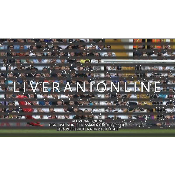 Liverpool\'s Raheem Sterling scores the opening goal Photographer Kieran Galvin/CameraSport Football - Barclays Premiership - Tottenham Hotspur v Liverpool - Sunday 31st August 2014 - White Hart Lane - London © CameraSport - 43 Linden Ave. Countesthorpe. Leicester. England. LE8 5PG - Tel: +44 (0) 116 277 4147 - admin@camerasport.com - www.camerasport.com /Agenzia Aldo Liverani sas - ITALY ONLY - EDITORIAL USE ONLY