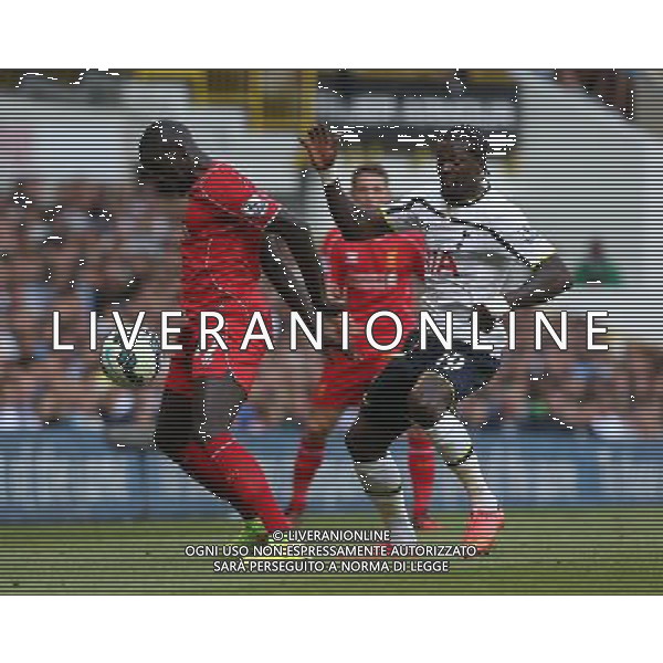 Liverpool\'s Mamadou Sakho despite the attentions of Tottenham Hotspur\'s Emmanuel Adebayor Photographer Kieran Galvin/CameraSport Football - Barclays Premiership - Tottenham Hotspur v Liverpool - Sunday 31st August 2014 - White Hart Lane - London © CameraSport - 43 Linden Ave. Countesthorpe. Leicester. England. LE8 5PG - Tel: +44 (0) 116 277 4147 - admin@camerasport.com - www.camerasport.com /Agenzia Aldo Liverani sas - ITALY ONLY - EDITORIAL USE ONLY