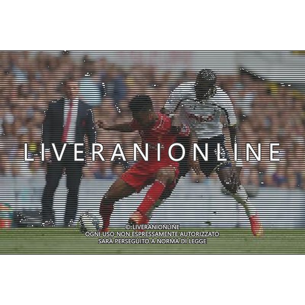 Liverpool\'s Raheem Sterling despite the attentions of Tottenham Hotspur\'s Emmanuel Adebayor Photographer Kieran Galvin/CameraSport Football - Barclays Premiership - Tottenham Hotspur v Liverpool - Sunday 31st August 2014 - White Hart Lane - London © CameraSport - 43 Linden Ave. Countesthorpe. Leicester. England. LE8 5PG - Tel: +44 (0) 116 277 4147 - admin@camerasport.com - www.camerasport.com /Agenzia Aldo Liverani sas - ITALY ONLY - EDITORIAL USE ONLY