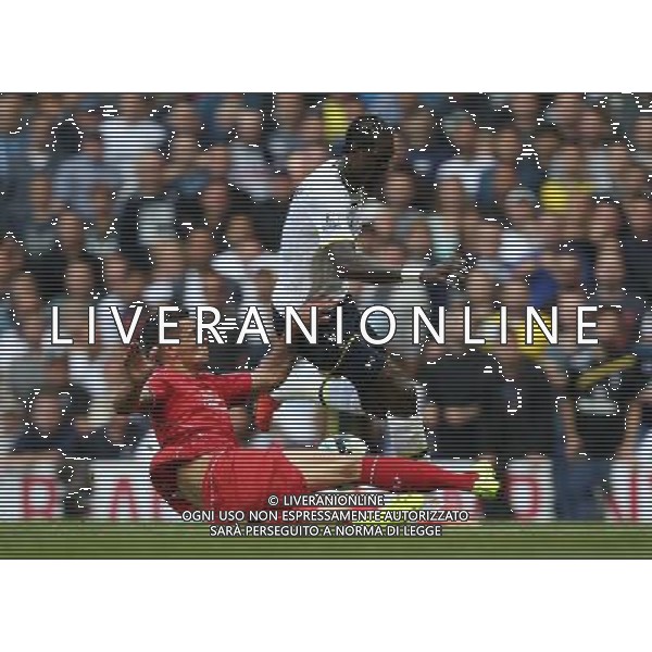 Tottenham Hotspur\'s Emmanuel Adebayor is tackled by Liverpool\'s Dejan Lovren Photographer Kieran Galvin/CameraSport Football - Barclays Premiership - Tottenham Hotspur v Liverpool - Sunday 31st August 2014 - White Hart Lane - London © CameraSport - 43 Linden Ave. Countesthorpe. Leicester. England. LE8 5PG - Tel: +44 (0) 116 277 4147 - admin@camerasport.com - www.camerasport.com /Agenzia Aldo Liverani sas - ITALY ONLY - EDITORIAL USE ONLY