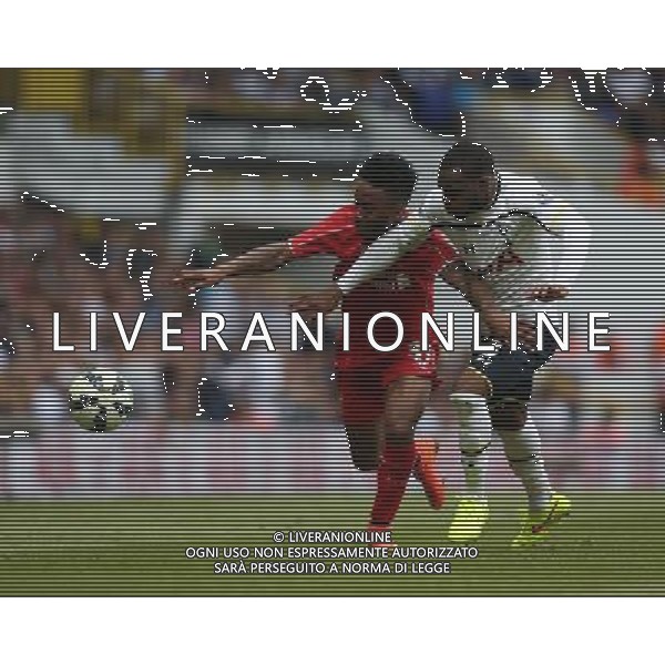 Liverpool\'s Raheem Sterling despite the attentions of Tottenham Hotspur\'s Danny Rose Photographer Kieran Galvin/CameraSport Football - Barclays Premiership - Tottenham Hotspur v Liverpool - Sunday 31st August 2014 - White Hart Lane - London © CameraSport - 43 Linden Ave. Countesthorpe. Leicester. England. LE8 5PG - Tel: +44 (0) 116 277 4147 - admin@camerasport.com - www.camerasport.com /Agenzia Aldo Liverani sas - ITALY ONLY - EDITORIAL USE ONLY