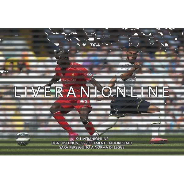 Liverpool\'s Mario Balotelli despite the attentions of Tottenham Hotspur\'s Younes Kaboul Photographer Kieran Galvin/CameraSport Football - Barclays Premiership - Tottenham Hotspur v Liverpool - Sunday 31st August 2014 - White Hart Lane - London © CameraSport - 43 Linden Ave. Countesthorpe. Leicester. England. LE8 5PG - Tel: +44 (0) 116 277 4147 - admin@camerasport.com - www.camerasport.com /Agenzia Aldo Liverani sas - ITALY ONLY - EDITORIAL USE ONLY