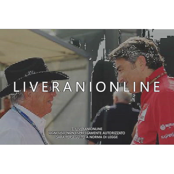 (L to R): Mario Andretti (USA) with Marco Mattiacci (ITA) Ferrari Team Principal. 04.09.2014. Formula 1 World Championship, Rd 13, Italian Grand Prix, Monza, Italy, Preparation Day. AG ALDO LIVERANI SAS ONLY ITALY