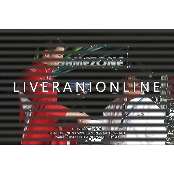 Alexander Rossi (USA) Marussia F1 Team Reserve Driver with Mario Andretti (USA) Circuit of The Americas\' Official Ambassador. 04.09.2014. Formula 1 World Championship, Rd 13, Italian Grand Prix, Monza, Italy, Preparation Day. AG ALDO LIVERANI SAS ONLY ITALY