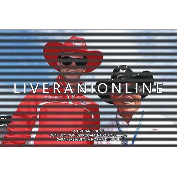 (L to R): Alexander Rossi (USA) Marussia F1 Team Reserve Driver with Mario Andretti (USA) Circuit of The Americas\' Official Ambassador. 04.09.2014. Formula 1 World Championship, Rd 13, Italian Grand Prix, Monza, Italy, Preparation Day. AG ALDO LIVERANI SAS ONLY ITALY