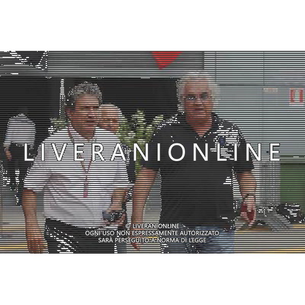 (L to R): Pasquale Lattuneddu (ITA) of the FOM with Flavio Briatore (ITA). 05.09.2014. Formula 1 World Championship, Rd 13, Italian Grand Prix, Monza, Italy, Practice Day. AG ALDO LIVERANI SAS ONLY ITALY