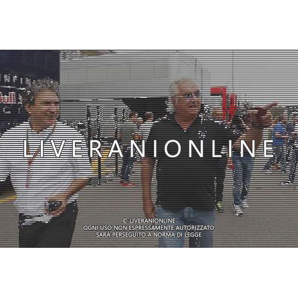 (L to R): Pasquale Lattuneddu (ITA) of the FOM with Flavio Briatore (ITA). 05.09.2014. Formula 1 World Championship, Rd 13, Italian Grand Prix, Monza, Italy, Practice Day. AG ALDO LIVERANI SAS ONLY ITALY