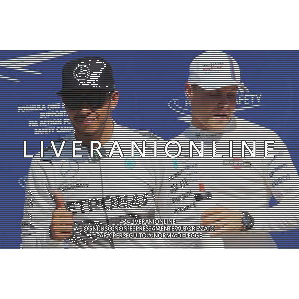 (L to R): Lewis Hamilton (GBR) Mercedes AMG F1 celebrates his pole position in parc ferme with third placed Valtteri Bottas (FIN) Williams. 06.09.2014. Formula 1 World Championship, Rd 13, Italian Grand Prix, Monza, Italy, Qualifying Day. - www.xpbimages.com, EMail: requests@xpbimages.com - copy of publication required for printed pictures. Every used picture is fee-liable. © Copyright: Moy / XPB Images /AGENZIA ALDO LIVERANI SAS - ITALY ONLY - Gp F1 Monza italia prove ufficiali