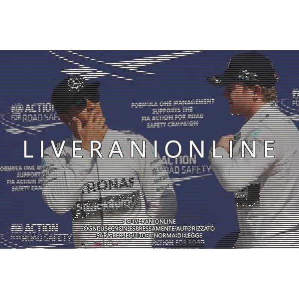 (L to R): Pole sitter Lewis Hamilton (GBR) Mercedes AMG F1 in parc ferme with team mate Nico Rosberg (GER) Mercedes AMG F1. 06.09.2014. Formula 1 World Championship, Rd 13, Italian Grand Prix, Monza, Italy, Qualifying Day. - www.xpbimages.com, EMail: requests@xpbimages.com - copy of publication required for printed pictures. Every used picture is fee-liable. © Copyright: Photo4 / XPB Images /AGENZIA ALDO LIVERANI SAS - ITALY ONLY - Gp F1 Monza italia prove ufficiali