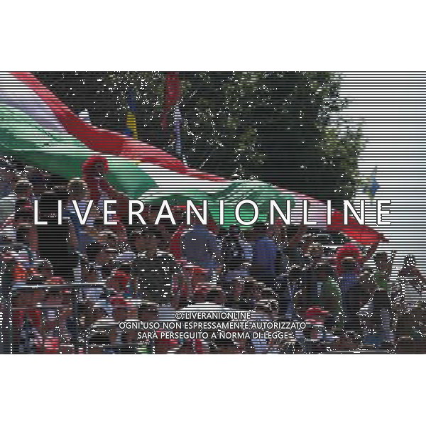 Fans with a large Italian flag. 06.09.2014. Formula 1 World Championship, Rd 13, Italian Grand Prix, Monza, Italy, Qualifying Day. - www.xpbimages.com, EMail: requests@xpbimages.com - copy of publication required for printed pictures. Every used picture is fee-liable. © Copyright: Price / XPB Images /AGENZIA ALDO LIVERANI SAS - ITALY ONLY - Gp F1 Monza italia prove ufficiali