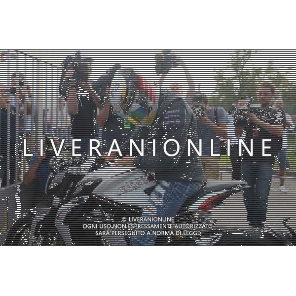 Lewis Hamilton (GBR) Mercedes AMG F1 arrives at the circuit on a motorbike. 07.09.2014. Formula 1 World Championship, Rd 13, Italian Grand Prix, Monza, Italy, Race Day. - www.xpbimages.com, EMail: requests@xpbimages.com - copy of publication required for printed pictures. Every used picture is fee-liable. © Copyright: Price / XPB Images /AGENZIA ALDO LIVERANI SAS - ITALY ONLY - Gp F1 Monza italia Gara
