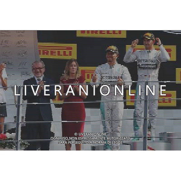 Race winner Lewis Hamilton (GBR) Mercedes AMG F1 celebrates on the podium. 07.09.2014. Formula 1 World Championship, Rd 13, Italian Grand Prix, Monza, Italy, Race Day. - www.xpbimages.com, EMail: requests@xpbimages.com - copy of publication required for printed pictures. Every used picture is fee-liable. © Copyright: Moy / XPB Images /AGENZIA ALDO LIVERANI SAS - ITALY ONLY - Gp F1 Monza italia Gara
