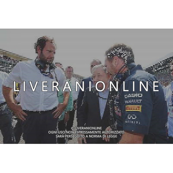 (L to R): Matteo Bonciani (ITA) FIA Media Delegate with Jean Todt (FRA) FIA President and Christian Horner (GBR) Red Bull Racing Team Principal on the grid. 07.09.2014. Formula 1 World Championship, Rd 13, Italian Grand Prix, Monza, Italy, Race Day. AG ALDO LIVERANI SAS ONLY ITALY