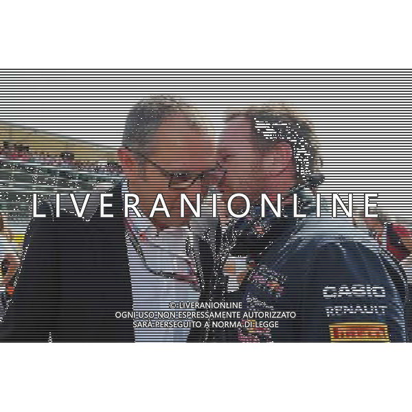 (L to R): Stefano Domenicali (ITA) with Christian Horner (GBR) Red Bull Racing Team Principal on the grid. 07.09.2014. Formula 1 World Championship, Rd 13, Italian Grand Prix, Monza, Italy, Race Day. AG ALDO LIVERANI SAS ONLY ITALY