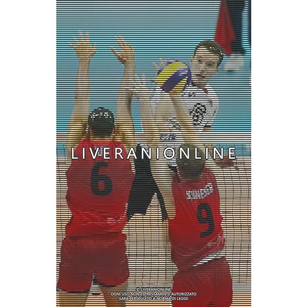 14.09.2014 - Katowice , Mistrzostwa Swiata . POLAND, FIVB Volleyball Men\'s World Championship 2014 . Niemcy (bialo-czarne - Kanada (czerwone) n/z. Denys Kaliberda . Fot. Tomasz Wantula / EDYTOR.net / NEWSPIX.PL --- Newspix.pl /Agenzia Aldo Liverani sas - ITALY ONLY - Germania - Canada Campionati Mondiali Volley maschile FIVB pallavolo Polonia 2014 *** Local Caption *** www.newspix.pl mail us: info@newspix.pl call us: 0048 022 23 22 222 --- Polish Picture Agency by Ringier Axel Springer Poland