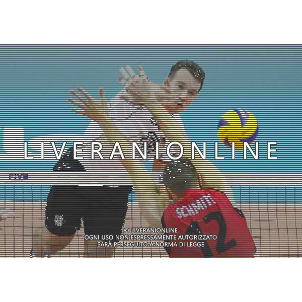 14.09.2014 - Katowice , Mistrzostwa Swiata . POLAND, FIVB Volleyball Men\'s World Championship 2014 . Niemcy (bialo-czarne - Kanada (czerwone) n/z. Denys Kaliberda . Fot. Tomasz Wantula / EDYTOR.net / NEWSPIX.PL --- Newspix.pl /Agenzia Aldo Liverani sas - ITALY ONLY - Germania - Canada Campionati Mondiali Volley maschile FIVB pallavolo Polonia 2014 *** Local Caption *** www.newspix.pl mail us: info@newspix.pl call us: 0048 022 23 22 222 --- Polish Picture Agency by Ringier Axel Springer Poland
