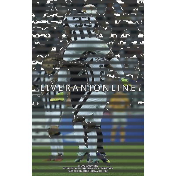 UEFA Champions League 2014/2015 Gruppo A Torino - 16.09.2014 Juventus-Malmo Nella Foto:evra salta sopra asamoah /Ph.Vitez-Ag. Aldo Liverani