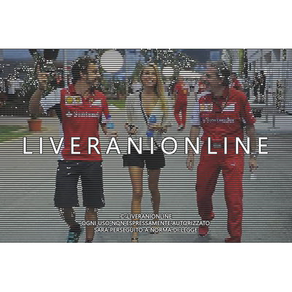 Fernando Alonso (ESP) Ferrari with his girlfriend Dasha Kapustina (RUS). 18.09.2014. Formula 1 World Championship, Rd 14, Singapore Grand Prix, Singapore, Singapore, Preparation Day. - www.xpbimages.com, EMail: requests@xpbimages.com - copy of publication required for printed pictures. Every used picture is fee-liable. © Copyright: Price / XPB Images /Agenzia Aldo Liverani sas - ITALY ONLY - EDITORIAL USE ONLY