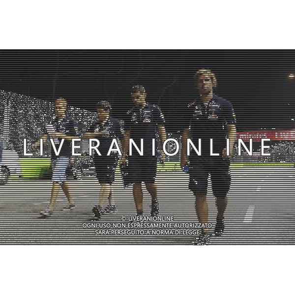Sebastian Vettel (GER) Red Bull Racing (Left) walks the circuit. 18.09.2014. Formula 1 World Championship, Rd 14, Singapore Grand Prix, Singapore, Singapore, Preparation Day. - www.xpbimages.com, EMail: requests@xpbimages.com - copy of publication required for printed pictures. Every used picture is fee-liable. © Copyright: Price / XPB Images /Agenzia Aldo Liverani sas - ITALY ONLY - EDITORIAL USE ONLY