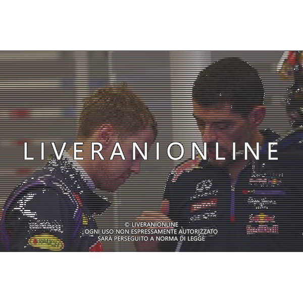(L to R): Sebastian Vettel (GER) Red Bull Racing with Guillaume Rocquelin (ITA) Red Bull Racing Race Engineer. 19.09.2014. Formula 1 World Championship, Rd 14, Singapore Grand Prix, Singapore, Singapore, Practice Day. - www.xpbimages.com, EMail: requests@xpbimages.com - copy of publication required for printed pictures. Every used picture is fee-liable. © Copyright: Batchelor / XPB Images /Agenzia Aldo Liverani sas - ITALY ONLY - EDITORIAL USE ONLY - PROVE LIBERE