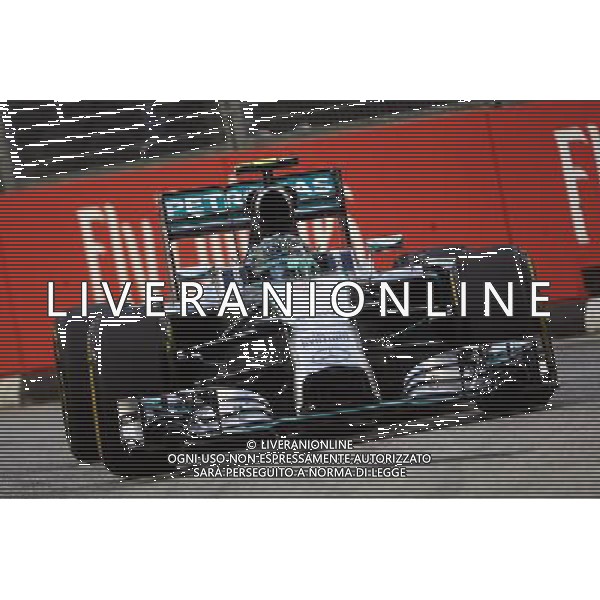 Nico Rosberg (GER) Mercedes AMG F1 W05. 19.09.2014. Formula 1 World Championship, Rd 14, Singapore Grand Prix, Singapore, Singapore, Practice Day. - www.xpbimages.com, EMail: requests@xpbimages.com - copy of publication required for printed pictures. Every used picture is fee-liable. © Copyright: Photo4 / XPB Images /Agenzia Aldo Liverani sas - ITALY ONLY - EDITORIAL USE ONLY - PROVE LIBERE