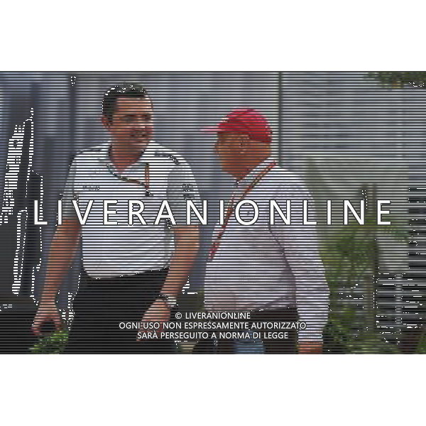 (L to R): Eric Boullier (FRA) McLaren Racing Director with Niki Lauda (AUT) Mercedes Non-Executive Chairman. 19.09.2014. Formula 1 World Championship, Rd 14, Singapore Grand Prix, Singapore, Singapore, Practice Day. - www.xpbimages.com, EMail: requests@xpbimages.com - copy of publication required for printed pictures. Every used picture is fee-liable. © Copyright: Price / XPB Images /Agenzia Aldo Liverani sas - ITALY ONLY - EDITORIAL USE ONLY - Gp F1 Singapore - Prove Libere