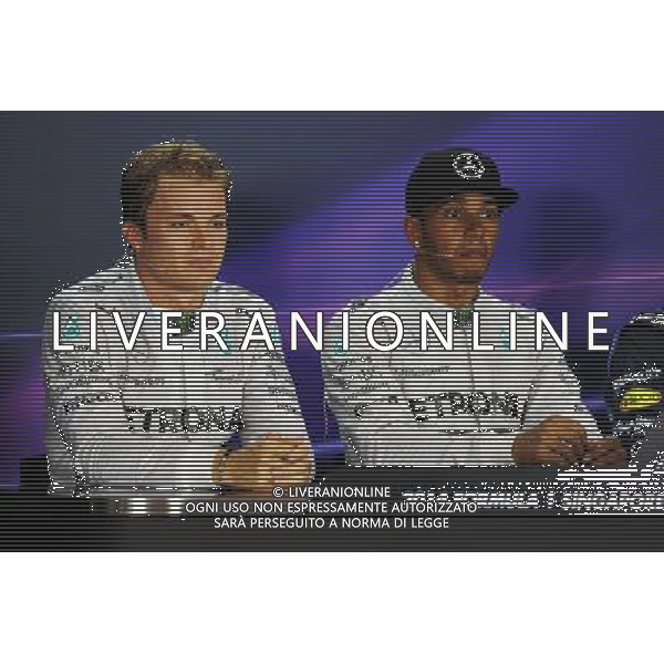 The post qualifying FIA Press Conference (L to R): Nico Rosberg (GER) Mercedes AMG F1, second; Lewis Hamilton (GBR) Mercedes AMG F1, pole position. 20.09.2014. Formula 1 World Championship, Rd 14, Singapore Grand Prix, Singapore, Singapore, Qualifying Day. - www.xpbimages.com, EMail: requests@xpbimages.com - copy of publication required for printed pictures. Every used picture is fee-liable. © Copyright: Price / XPB Images /Agenzia Aldo Liverani sas - ITALY ONLY - EDITORIAL USE ONLY - Gp F1 Singapore - Prove di Qualifica