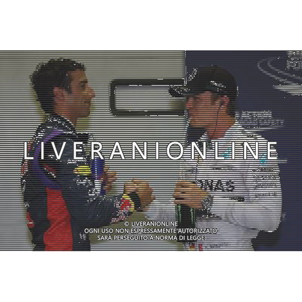 (L to R): Third placed Daniel Ricciardo (AUS) Red Bull Racing with second placed Nico Rosberg (GER) Mercedes AMG F1 in qualifying parc ferme. 20.09.2014. Formula 1 World Championship, Rd 14, Singapore Grand Prix, Singapore, Singapore, Qualifying Day. - www.xpbimages.com, EMail: requests@xpbimages.com - copy of publication required for printed pictures. Every used picture is fee-liable. © Copyright: Photo4 / XPB Images /Agenzia Aldo Liverani sas - ITALY ONLY - EDITORIAL USE ONLY - Gp F1 Singapore - Prove di Qualifica