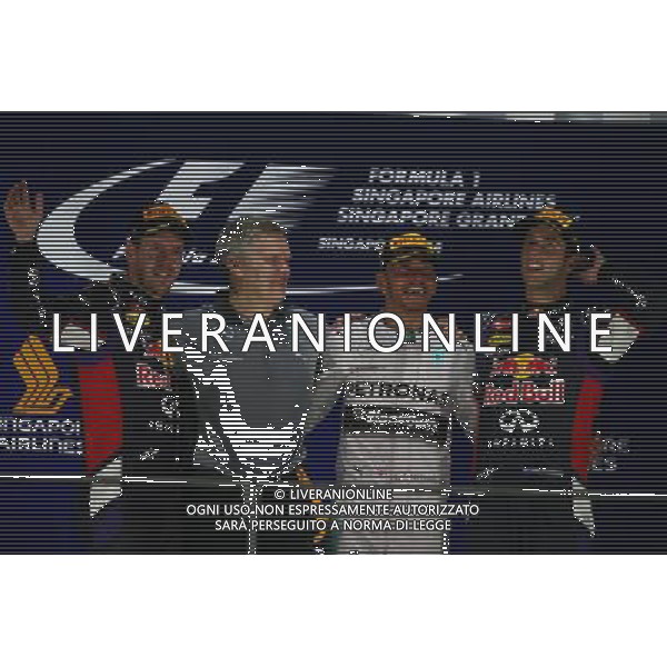 1st place Lewis Hamilton (GBR) Mercedes AMG F1, 2nd place Sebastian Vettel (GER) Red Bull Racing RB10 and 3rd place Daniel Ricciardo (AUS) Red Bull Racing RB10. 21.09.2014. Formula 1 World Championship, Rd 14, Singapore Grand Prix, Singapore, Singapore, Race Day. AG ALDO LIVERANI SAS ONLY ITALY