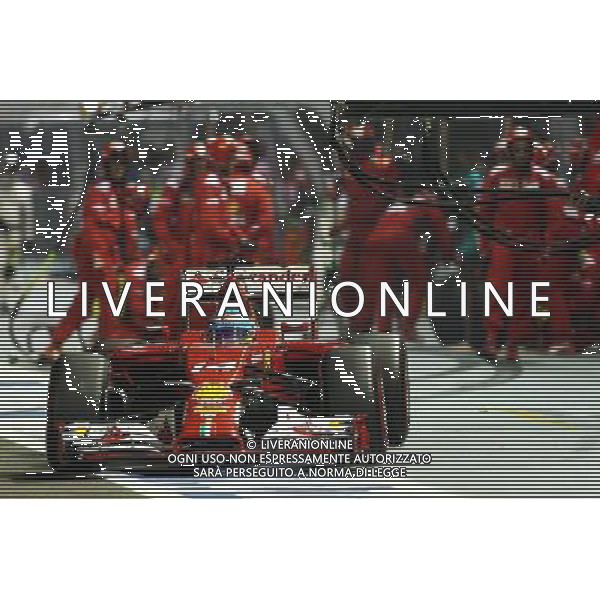 Fernando Alonso (ESP) Ferrari F14-T makes a pit stop. 21.09.2014. Formula 1 World Championship, Rd 14, Singapore Grand Prix, Singapore, Singapore, Race Day. AG ALDO LIVERANI SAS ONLY ITALY