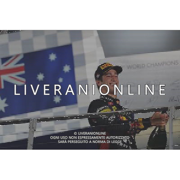 Daniel Ricciardo (AUS) Red Bull Racing celebrates his third position on the podium. 21.09.2014. Formula 1 World Championship, Rd 14, Singapore Grand Prix, Singapore, Singapore, Race Day. AG ALDO LIVERANI SAS ONLY ITALY