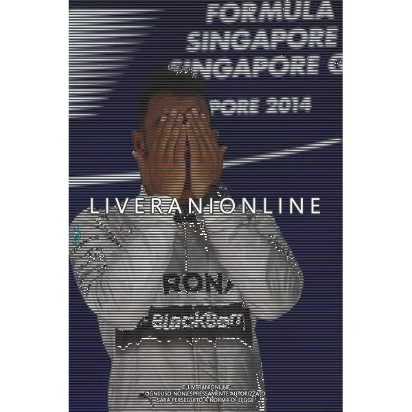 1st place Lewis Hamilton (GBR) Mercedes AMG F1. 21.09.2014. Formula 1 World Championship, Rd 14, Singapore Grand Prix, Singapore, Singapore, Race Day. AG ALDO LIVERANI SAS ONLY ITALY