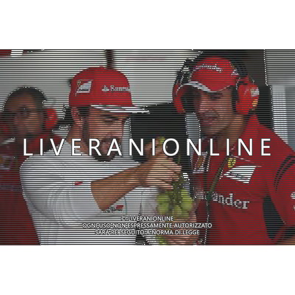 (L to R): Fernando Alonso (ESP) Ferrari with Marc Gene (ESP) Ferrari Test Driver. 03.10.2014. Formula 1 World Championship, Rd 15, Japanese Grand Prix, Suzuka, Japan, Practice Day. AG ALDO LIVERANI SAS ONLY ITALY