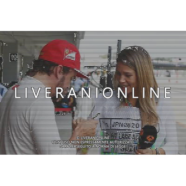 (L to R): Fernando Alonso (ESP) Ferrari with Nira Juanco (ESP) Antena 3 TV Presenter. 03.10.2014. Formula 1 World Championship, Rd 15, Japanese Grand Prix, Suzuka, Japan, Practice Day. AG ALDO LIVERANI SAS ONLY ITALY