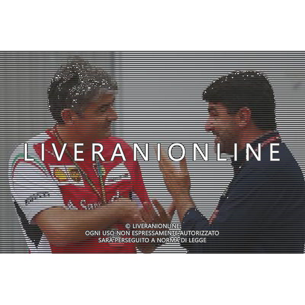 (L to R): Marco Mattiacci (ITA) Ferrari Team Principal with Luis Garcia Abad (ESP) Driver Manager of Fernando Alonso (ESP) Ferrari. 03.10.2014. Formula 1 World Championship, Rd 15, Japanese Grand Prix, Suzuka, Japan, Practice Day. AG ALDO LIVERANI SAS ONLY ITALY