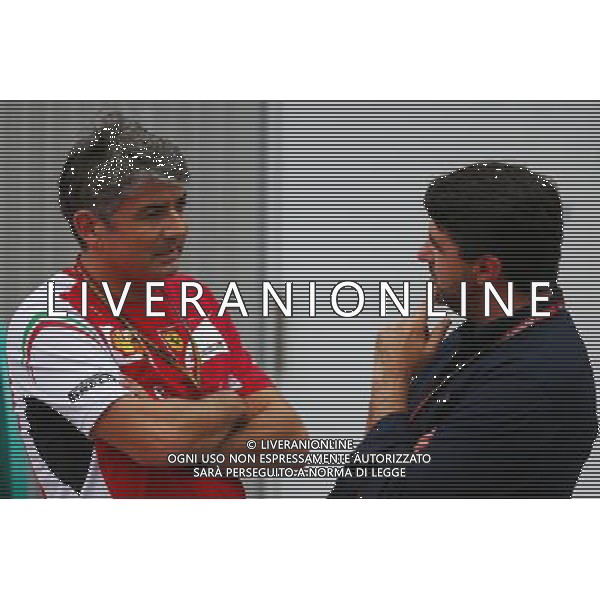 (L to R): Marco Mattiacci (ITA) Ferrari Team Principal with Luis Garcia Abad (ESP) Driver Manager of Fernando Alonso (ESP) Ferrari. 03.10.2014. Formula 1 World Championship, Rd 15, Japanese Grand Prix, Suzuka, Japan, Practice Day. AG ALDO LIVERANI SAS ONLY ITALY