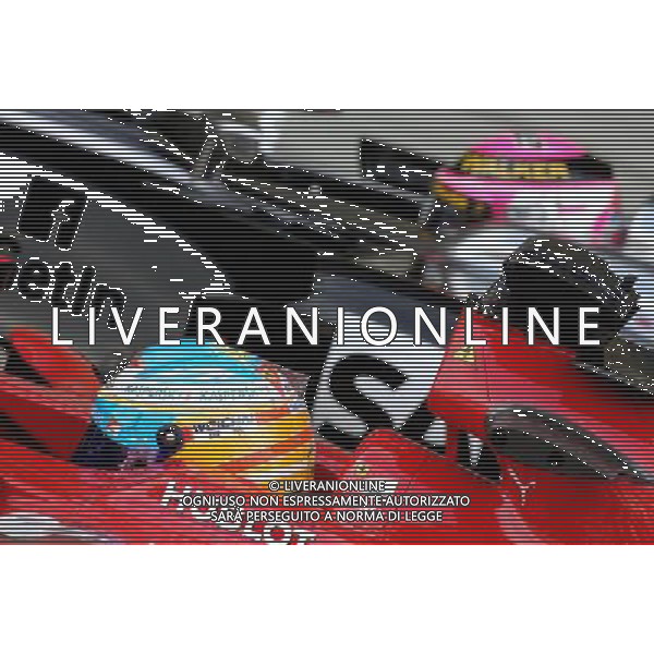 Fernando Alonso (ESP), Scuderia Ferrari and Jenson Button (GBR), McLaren F1 Team 04.10.2014. Formula 1 World Championship, Rd 15, Japanese Grand Prix, Suzuka, Japan, Qualifying Day. - www.xpbimages.com, EMail: requests@xpbimages.com - copy of publication required for printed pictures. Every used picture is fee-liable. © Copyright: Charniaux / XPB Images /Ag. Aldo Liverani s.a.s.-Only Italy-Editorial Use Only
