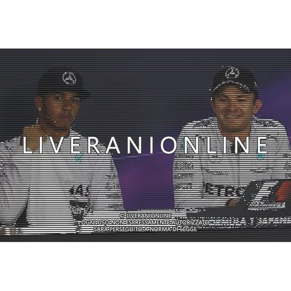 (L to R): Lewis Hamilton (GBR) Mercedes AMG F1 and team mate Nico Rosberg (GER) Mercedes AMG F1 in the FIA Press Conference. 04.10.2014. Formula 1 World Championship, Rd 15, Japanese Grand Prix, Suzuka, Japan, Qualifying Day. - www.xpbimages.com, EMail: requests@xpbimages.com - copy of publication required for printed pictures. Every used picture is fee-liable. © Copyright: Moy / XPB Images /Ag. Aldo Liverani s.a.s.-Only Italy-Editorial Use Only