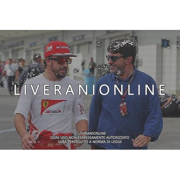 (L to R): Fernando Alonso (ESP) Ferrari with Luis Garcia Abad (ESP) Driver Manager. 04.10.2014. Formula 1 World Championship, Rd 15, Japanese Grand Prix, Suzuka, Japan, Qualifying Day. - www.xpbimages.com, EMail: requests@xpbimages.com - copy of publication required for printed pictures. Every used picture is fee-liable. © Copyright: Photo4 / XPB Images /Ag. Aldo Liverani s.a.s.-Only Italy-Editorial Use Only