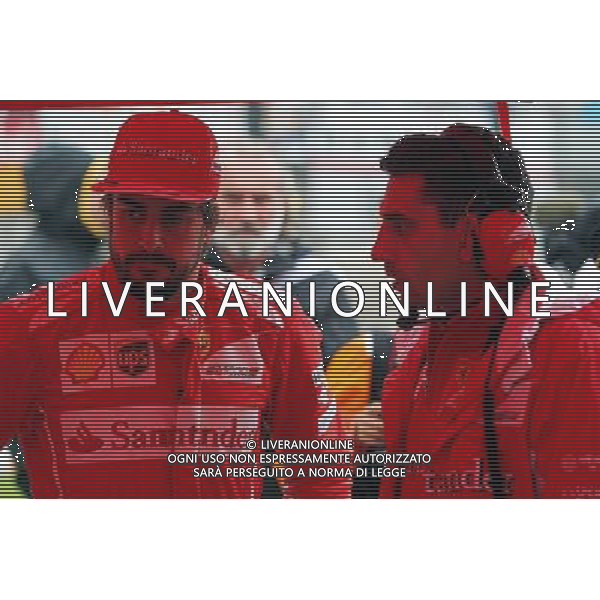 Fernando Alonso (ESP) Ferrari with Andrea Stella (ITA) Ferrari Race Engineer on the grid. 05.10.2014. Formula 1 World Championship, Rd 15, Japanese Grand Prix, Suzuka, Japan, Race Day. 