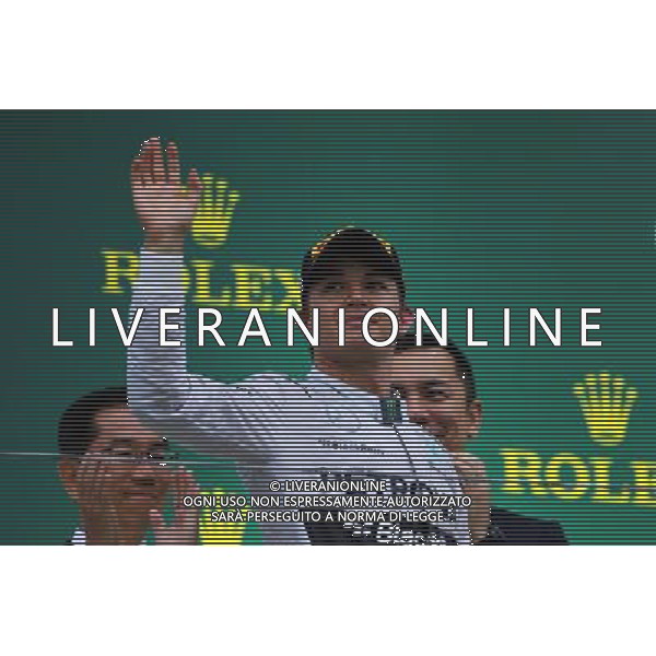 Nico Rosberg (GER) Mercedes AMG F1 celebrates his second position on the podium. 05.10.2014. Formula 1 World Championship, Rd 15, Japanese Grand Prix, Suzuka, Japan, Race Day. AG ALDO LIVERANI SAS ONLY ITALY