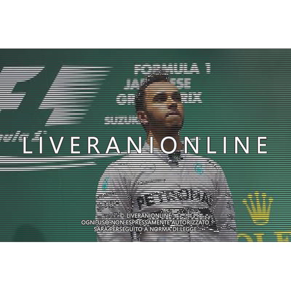 Race winner Lewis Hamilton (GBR) Mercedes AMG F1 on the podium. 05.10.2014. Formula 1 World Championship, Rd 15, Japanese Grand Prix, Suzuka, Japan, Race Day. AG ALDO LIVERANI SAS ONLY ITALY