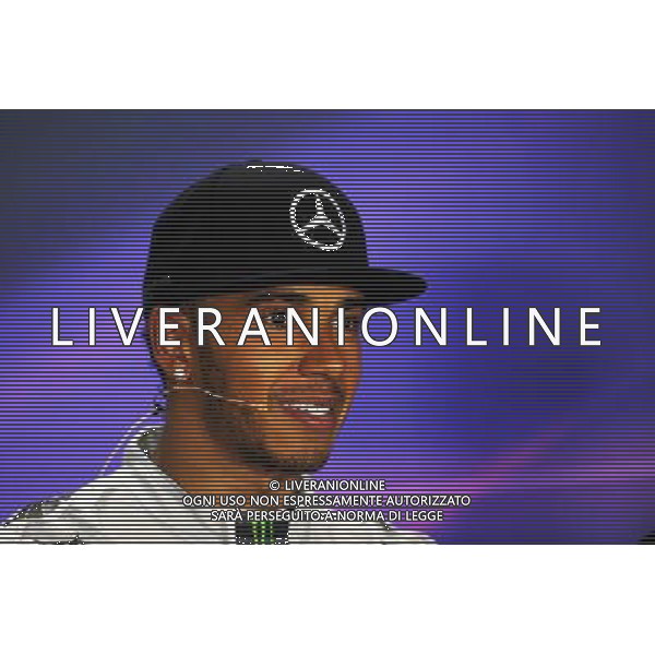 Race winner Lewis Hamilton (GBR) Mercedes AMG F1 in the FIA Press Conference. 21.09.2014. Formula 1 World Championship, Rd 14, Singapore Grand Prix, Singapore, Singapore, Race Day. 