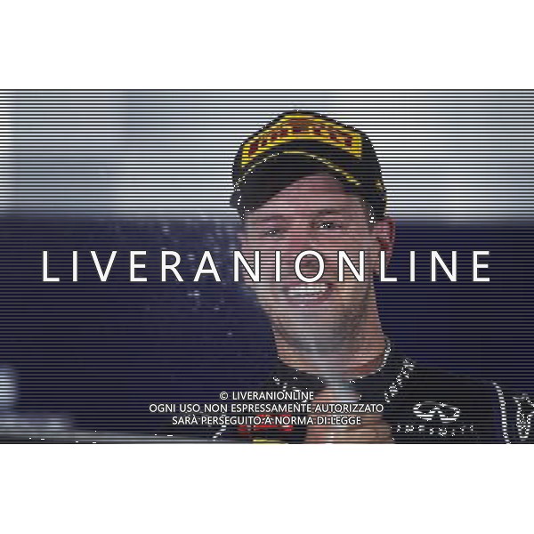 Sebastian Vettel (GER) Red Bull Racing celebrates his second position on the podium. 21.09.2014. Formula 1 World Championship, Rd 14, Singapore Grand Prix, Singapore, Singapore, Race Day. 