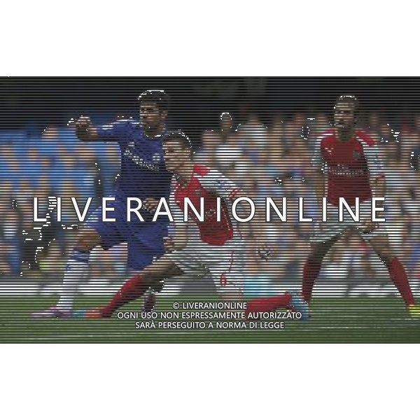 Chelsea\'s Diego Costa battles with Arsenal\'s Laurent Koscielny Photographer Ashley Western/CameraSport Football - Barclays Premiership - Chelsea v Arsenal - Sunday 05th October 2014 - Stamford Bridge - London © CameraSport - 43 Linden Ave. Countesthorpe. Leicester. England. LE8 5PG - Tel: +44 (0) 116 277 4147 - admin@camerasport.com - www.camerasport.com AG ALDO LIVERANI SAS ONLY ITALY
