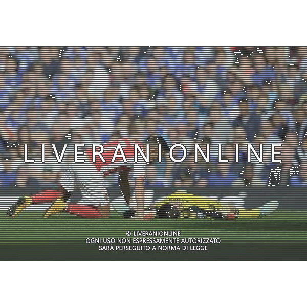 Chelsea\'s Thibaut Courtois injured in a challenge with Arsenal\'s Alexis Sanchez Photographer Ashley Western/CameraSport Football - Barclays Premiership - Chelsea v Arsenal - Sunday 05th October 2014 - Stamford Bridge - London © CameraSport - 43 Linden Ave. Countesthorpe. Leicester. England. LE8 5PG - Tel: +44 (0) 116 277 4147 - admin@camerasport.com - www.camerasport.com /Agenzia Aldo Liverani sas - ITALY ONLY - EDITORIAL USE ONLY